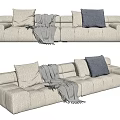 Modern Beige Sectional Sofa With Multiple Cushions Gray Accent Cushion And Fringed Blanket