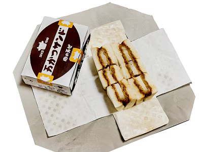 Japanese Sweet Tamagoyaki Rolled Omelette Sliced With Package On Paper Towel 3d model
