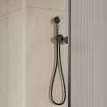 Modern Shower Head Fixture in Tiled Shower Room with Glass Partition and Metal Finish