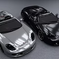 Two Silver And Black Convertible Sports Cars With Shiny Exterior Design