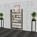 Wooden Decorative Cabinet With Multi tiered Shelves And Ornaments By Green Plants On Textured Wall