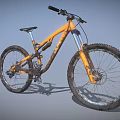 Orange Mountain Bike With Sturdy Frame Muddy Tires And Front Suspension