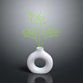 White Vase With Circular Hole Holding Green Branches In Simple Decor