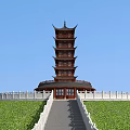 Traditional Chinese Multi story Pagoda With Curved Eaves And Wooden Structure Against Blue Sky