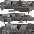Modern Gray Sectional Sofa With Patterned Pillows And Textured Blankets 3d model