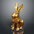 Golden Rabbit Statue In Sitting Position With Shiny Metallic Finish Against Dark Background