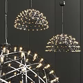 Stylish Chandeliers With Metal Frame And Small Glowing Lights Against Dark Wall