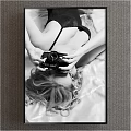 Black and White Figure Painting of Woman Lying on Bed Holding Camera