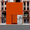 Red Storefront Facade Of Brick Building With Arched Windows And Glass Doors