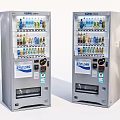 Public Facility Two Stainless Steel Vending Machines Dispensing Various Beverages