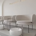 Modern Minimalist Beauty Hair Salon With White Furniture Curved Wall And Product Shelves