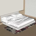 Modern Double Bed with Grey Headboard White Sheets and Colorful Rug on Wooden Floor