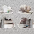 Four Cloud Shaped Mirrors Hanging On Gray Wall For Home Decoration
