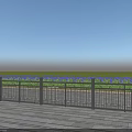 Metal Fence With Wooden Deck And Green Grass Under Blue Sky