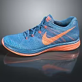 Nike Blue Running Shoes With Knitted Upper Orange Logo And Orange Sole