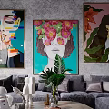 Modern Sectional Sofa with Decorative Pillows Green Plants and Wall Art