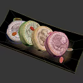 Panda Shaped Roll Cakes on Black Plate with Red Goji Berries