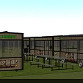 Commercial Food Trucks With Large Windows Benches And Tables On Grass With Blue Sky