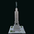 Tall Monument Structure With Stone Pedestal Top Statue Square Base And Green Patches