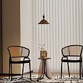 Cozy Indoor Corner With Two Woven Chairs Small Round Table Vase Flowers And White Blinds