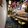 Japanese Restaurant Interior Featuring Sushi Bar Counter Yellow Chairs Cherry Blossom Decor And Lanterns