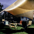 Garden Landscape With Camper Van White Canopy Green Lawn Trees And Outdoor Fire Pit