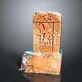 Ancient Architectural Carving With Intricate Relief Patterns Orange Red Stone And Weathered Base