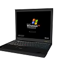 Classic Black Laptop Displaying Windows XP Login Screen on White Background