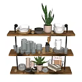 Three Tier Wooden Plant Stand With Green Plants Bowls Jars And Baskets