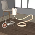 Copper Curved Candle Lamp With White Candle Small Bicycle Model On Light Wooden Tabletop
