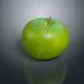 Fresh Green Apple With Yellow Spots On Shiny Surface And Dark Background