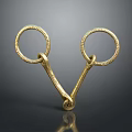Golden Metal Ring Shaped Household Item With Intricate Decorative Design