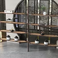 Chinese Style Wooden Shelving Unit Displaying Black Jars And Decorative Items In Interior Space