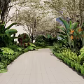 Lush Flowers and Plants Along Tropical Garden Path With Large Green Leaves Orange Blooms and Trees