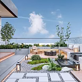 Modern Rooftop Garden With Green Plants Wooden Deck Stone Pathway Seating Water Feature Lantern Lights