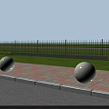 Outdoor Road Facilities Featuring Stone Spheres Brick Pavement And Black Iron Fence