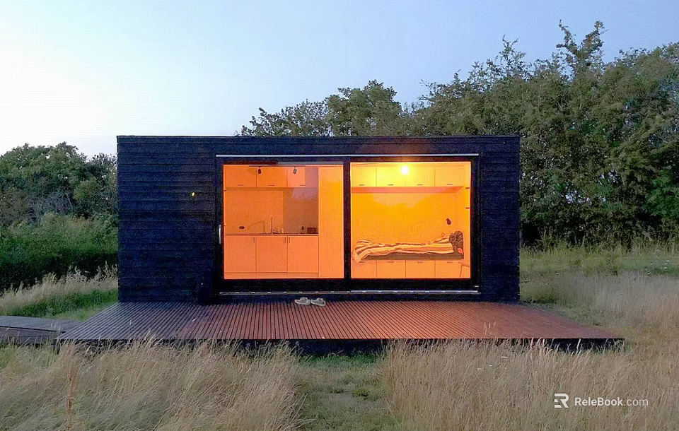 Black Detached House With Large Glass Windows And Lit Interior In Natural Surroundings 3d model 