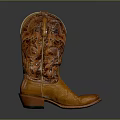 Vintage Brown Leather Cowboy Boots With Intricate Carved Design And Classic Style
