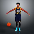 Man In Utah Jazz Number 45 Jersey Standing With Basketball On Gray Background