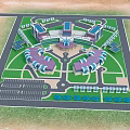Aerial View Plan of Modern Building Complex with Green Lawns Parking Lots and Road Layout