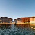Modern Waterfront Building With Wooden Structure Glass Facade Sloped Roof And Blue Sky