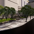 Modern Plaza Landscape with Glass Building Trees Geometric Pavement Umbrella Seating and Pedestrians