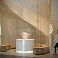 Modern Space With Spiral Glass Structure White Circular Platform Diamond Like Exhibit And Wooden Benches
