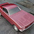 Burgundy Ford Mustang Parked On Asphalt Road