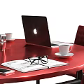 Round Red Conference Table With Black Red Office Chairs Laptop Coffee Cups Documents And Clock