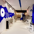 Fashion Store Interior Design With Blue Decor White Sofa And Gold Spherical Lights