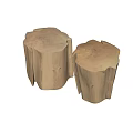 Two Natural Wood Tree Stump Shaped Stools With Rustic Texture And Tree Rings