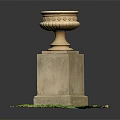 Decorative Stone Urn With Ornate Top On Square Pedestal In Green Grass