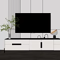 Modern White And Black TV Stand With Flat Screen TV Potted Plant And Table Lamp