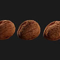 Three Whole Walnuts With Natural Shell Texture On Black Background